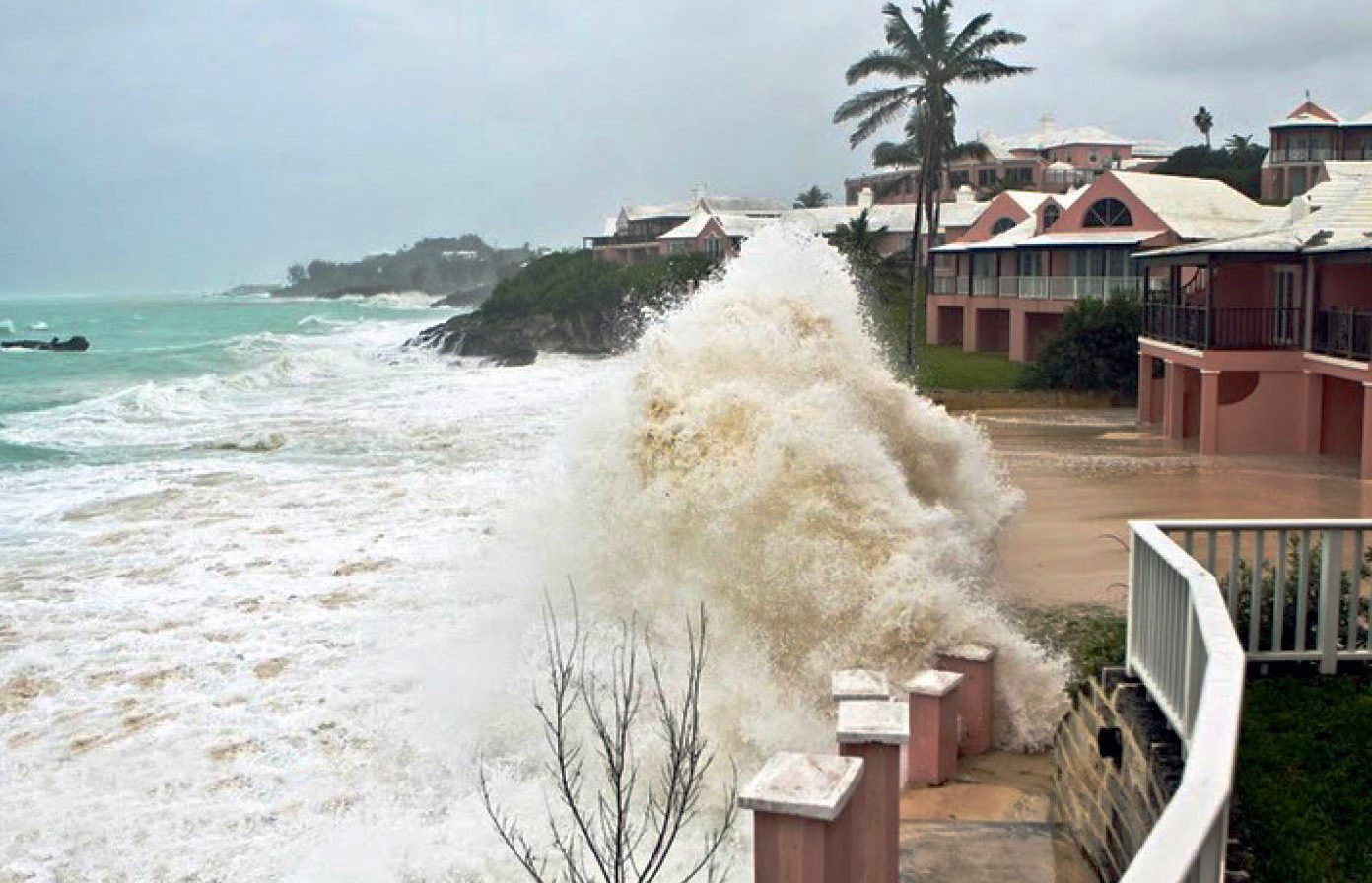 Large waves crashing against buildings