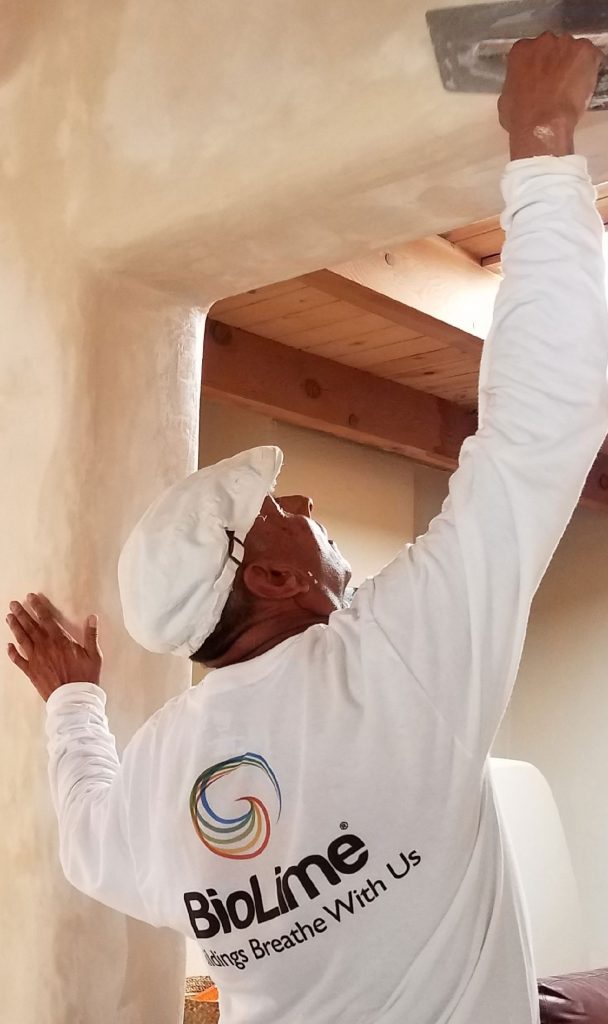 Lime plaster being applied on a wall